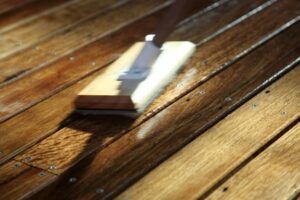 mopping a deck of a boat